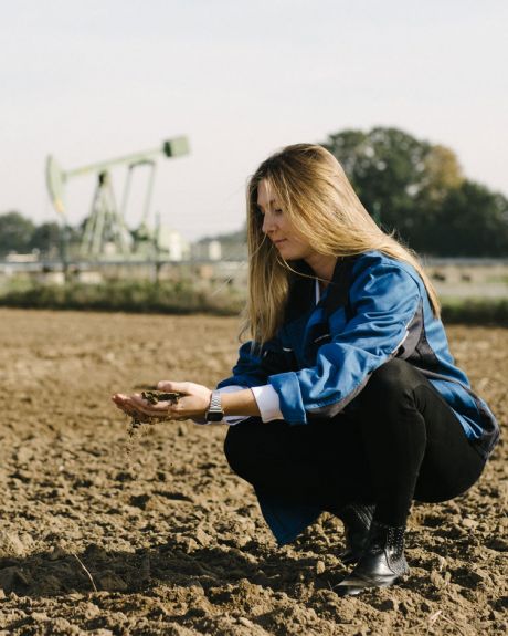 girl on a field examining probes