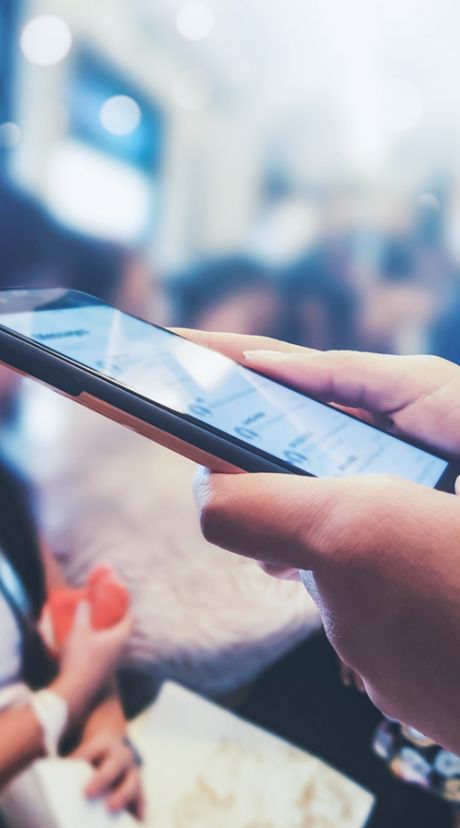Person swiping on mobile phone tablet